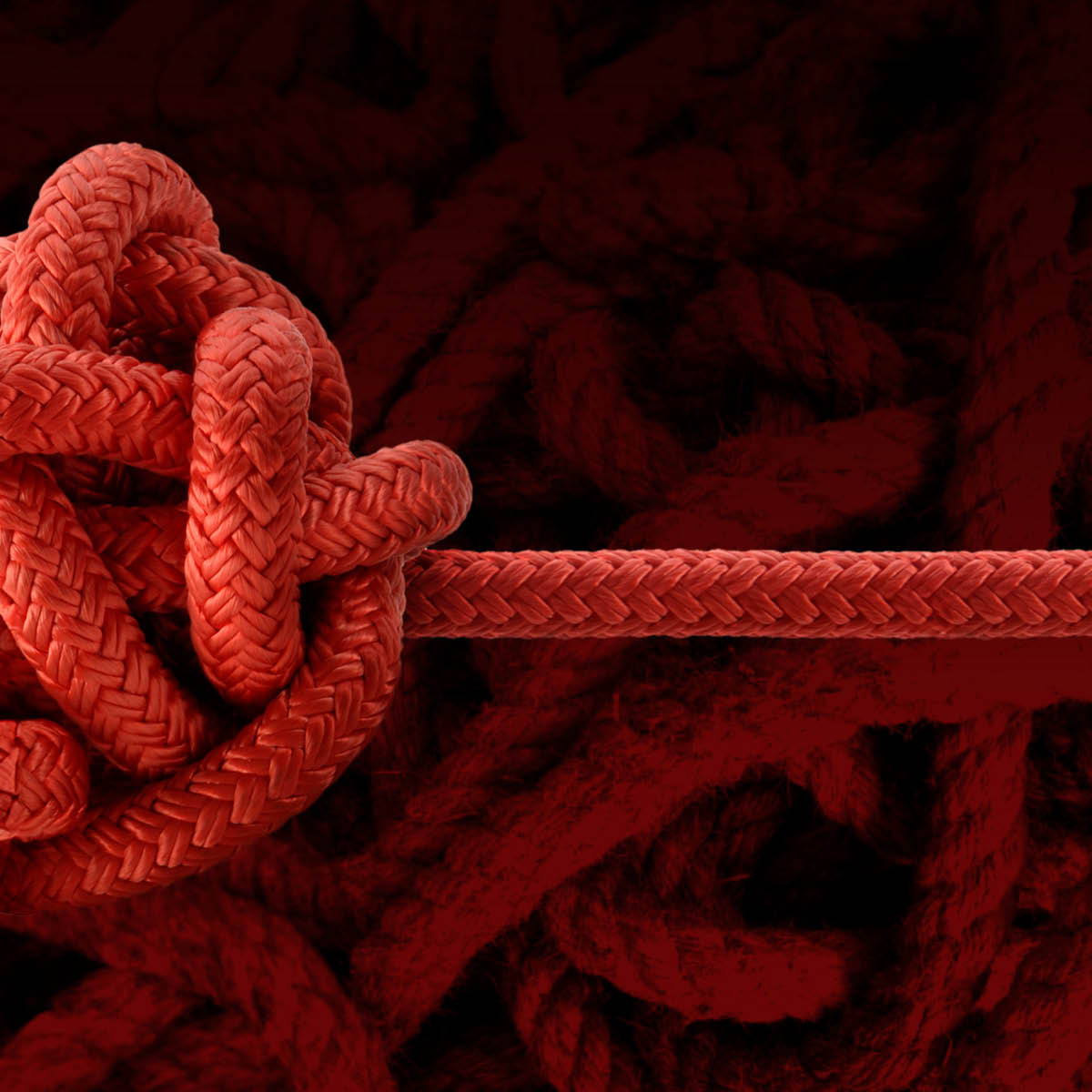 Jumbled knot with a single strand emerging to the right